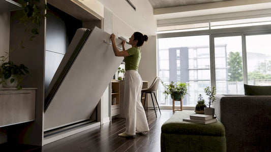 Woman transforming multi-use furniture in apartment