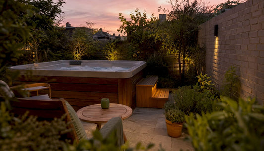 Minimalist hot tub on wooden deck in small yard
