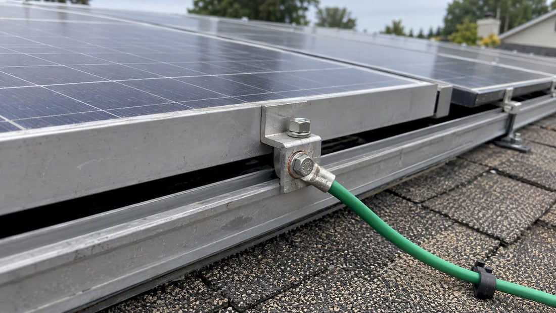 Solar module rail bonded with grounding conductor